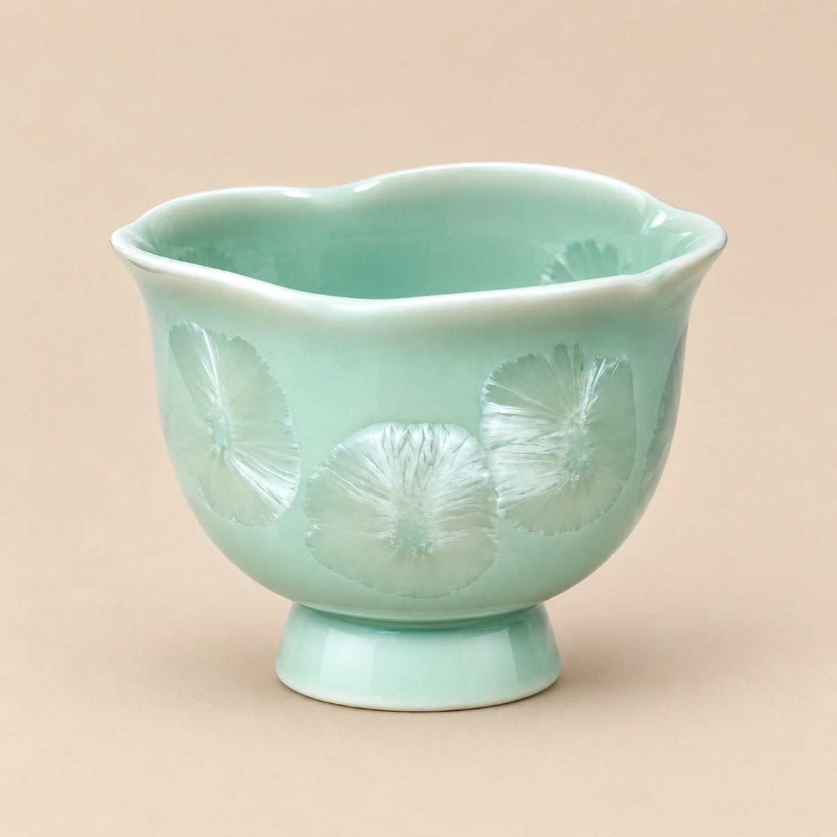 Celadon green ceramic footed tea cup with pearl white detail