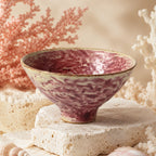 Vibrant coral pink ceramic dessert bowl with soft glazed texture