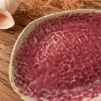 Close-up ceramic texture of coral pink oval plate