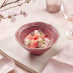 Coral pink ceramic rice bowl served with fresh food