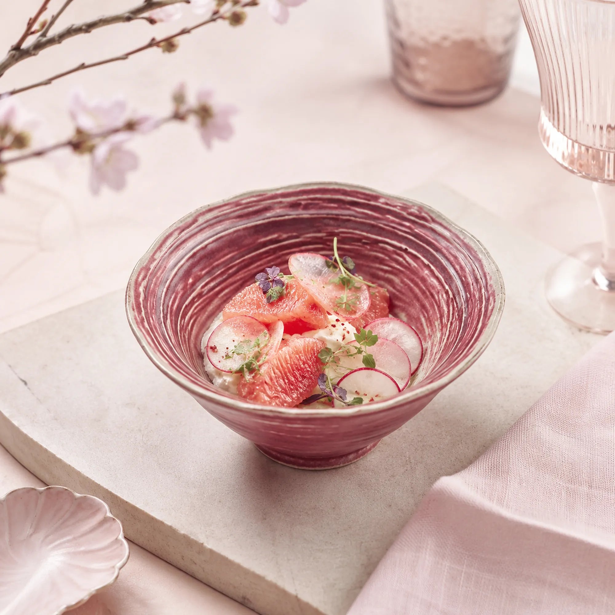 Coral pink ceramic rice bowl served with fresh food