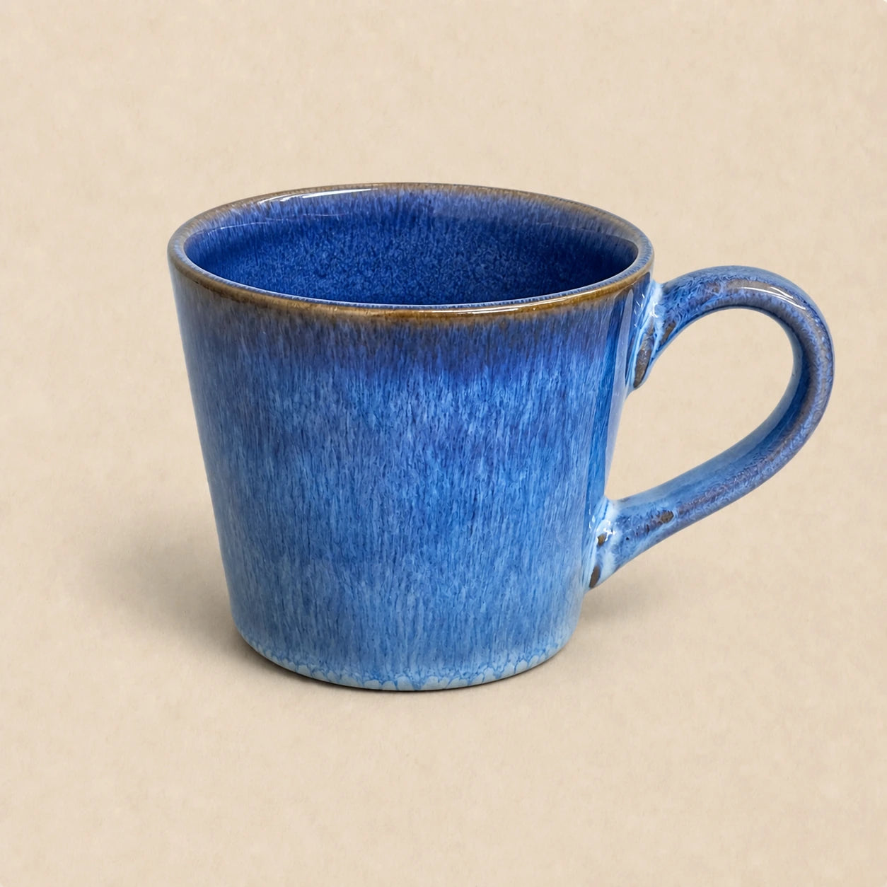 Flowing Blue Ceramic Coffee Mug by Ertha Home