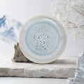 Crackle frost blue ceramic dinner plate with layered glaze texture