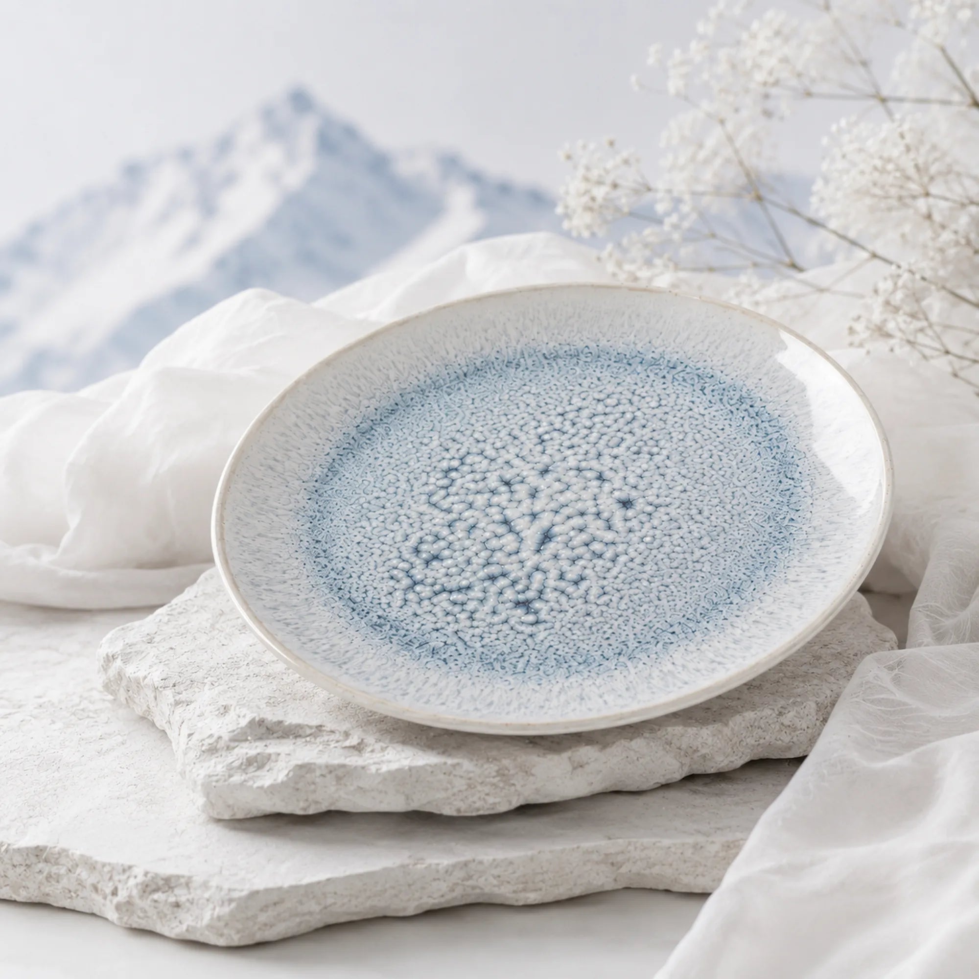 Frost blue ceramic dinnerware styled on a modern dining table
