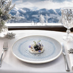 Frost blue ceramic dinner plate styled with plated food
