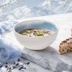 Frost blue ceramic rice bowl styled with warm food