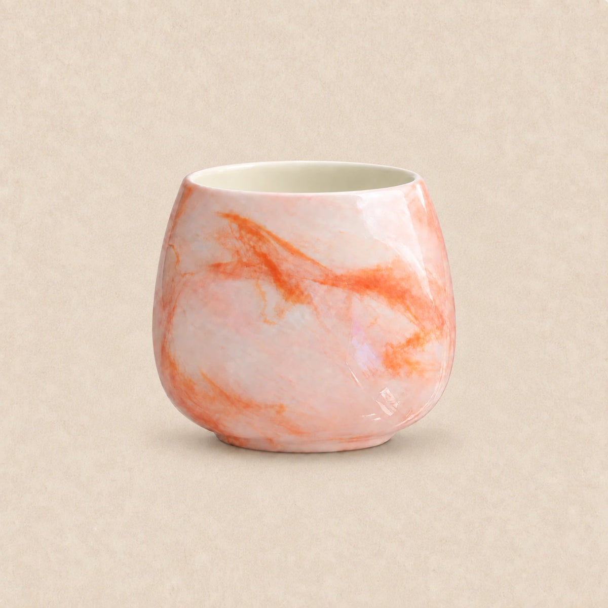 Afterglow ceramic coffee cup with peach, coral and orange glaze