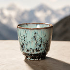 Crackle ice blue ceramic tea cup with textured glaze finish