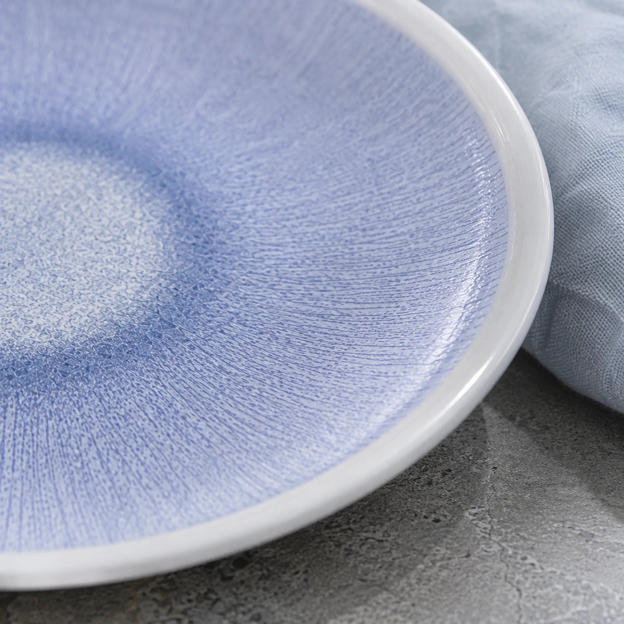 Close-up glaze texture of serene mist blue ceramic dinner plate
