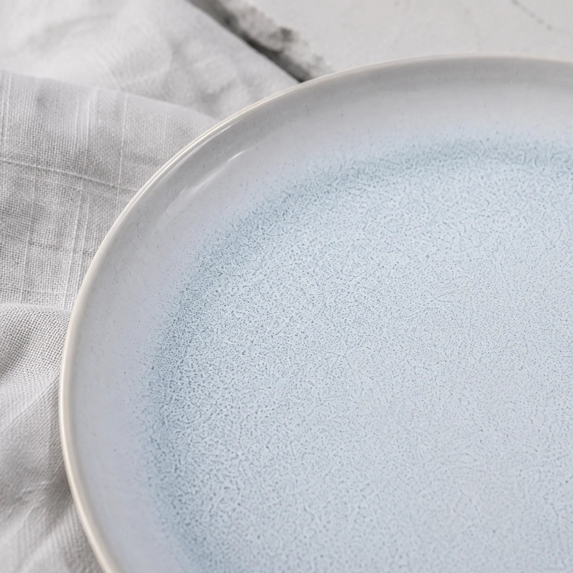 Close-up glaze texture of mist blue ceramic dinner plate