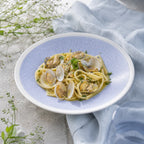 Serene mist blue ceramic dinner plate styled with fresh food