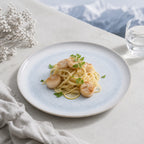 Mist blue ceramic dinner plate styled with fresh cuisine