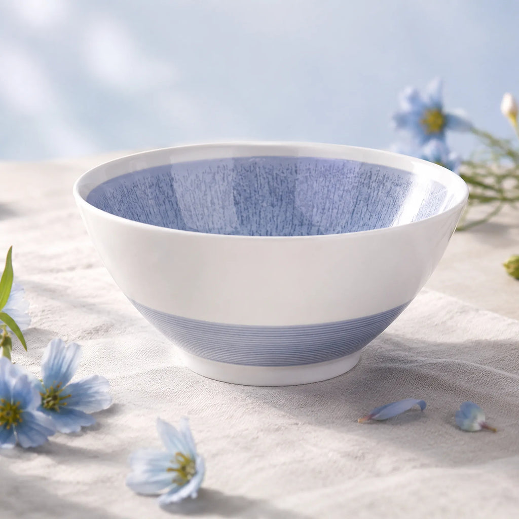 Mist blue ceramic soup bowl styled on a modern dining table