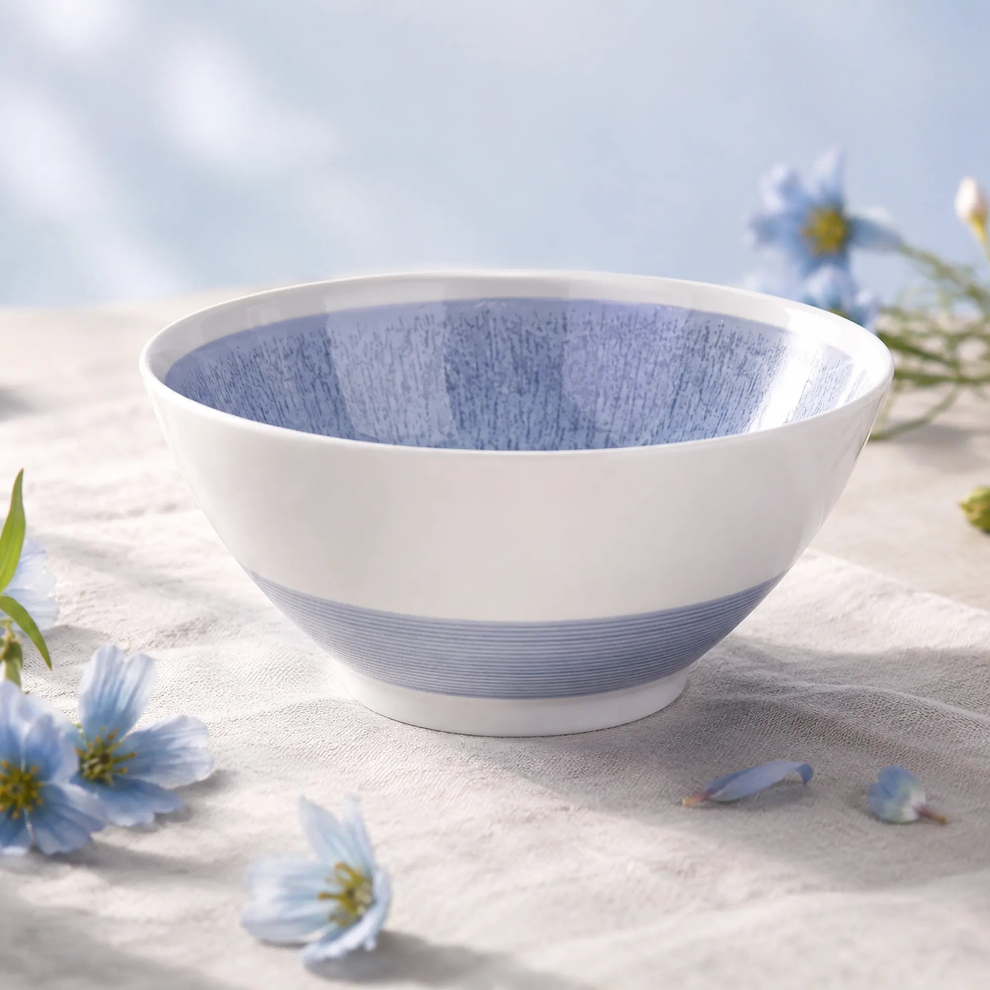Mist blue ceramic soup bowl styled on a modern dining table