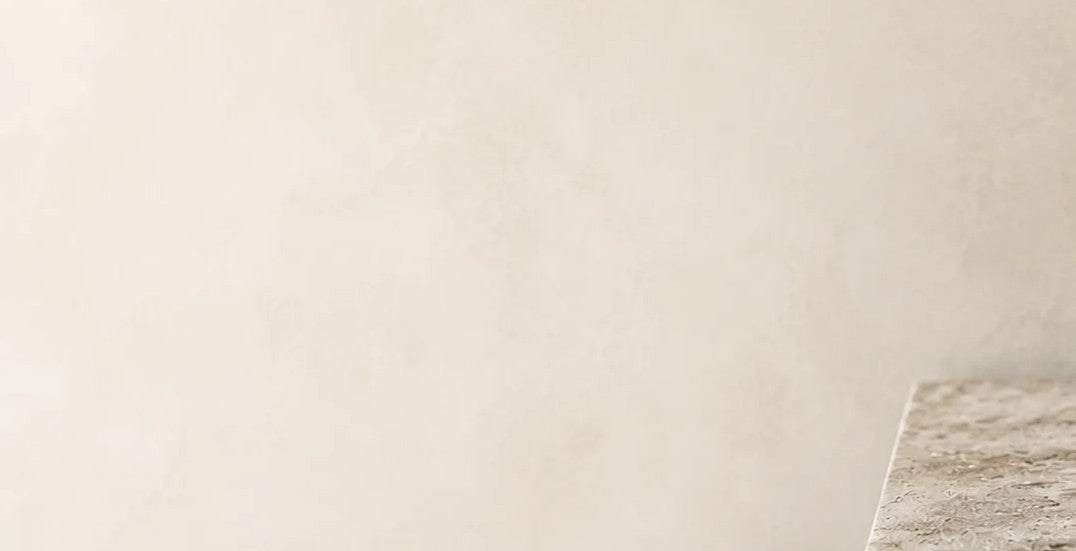 Neutral stone surface with a warm textured background