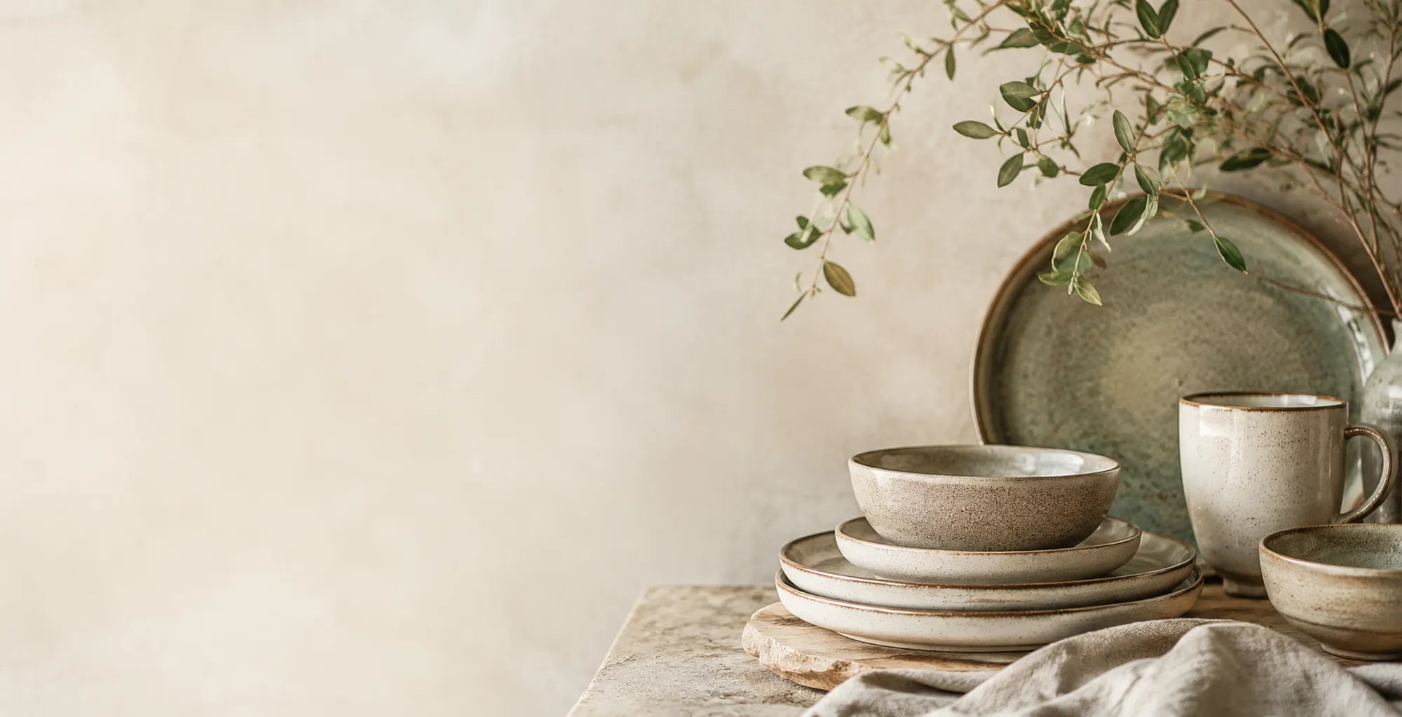 Nature-inspired ceramic tableware with unique glaze textures and handcrafted character