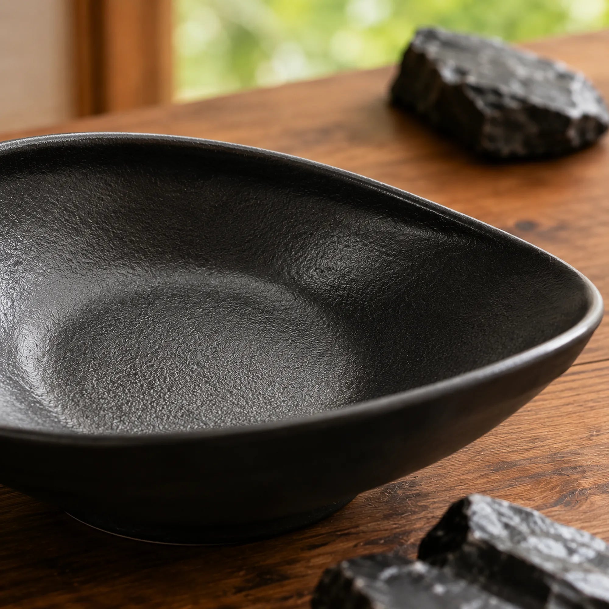 Close-up ceramic texture of obsidian black oval plate