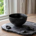 Textured obsidian black ceramic rice bowl with layered matte finish