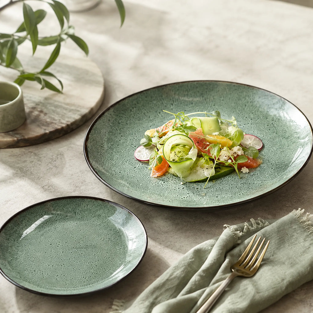 Peacock green ceramic dinner plate styled with fresh food