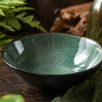 Close-up texture detail of peacock green ceramic pasta bowl