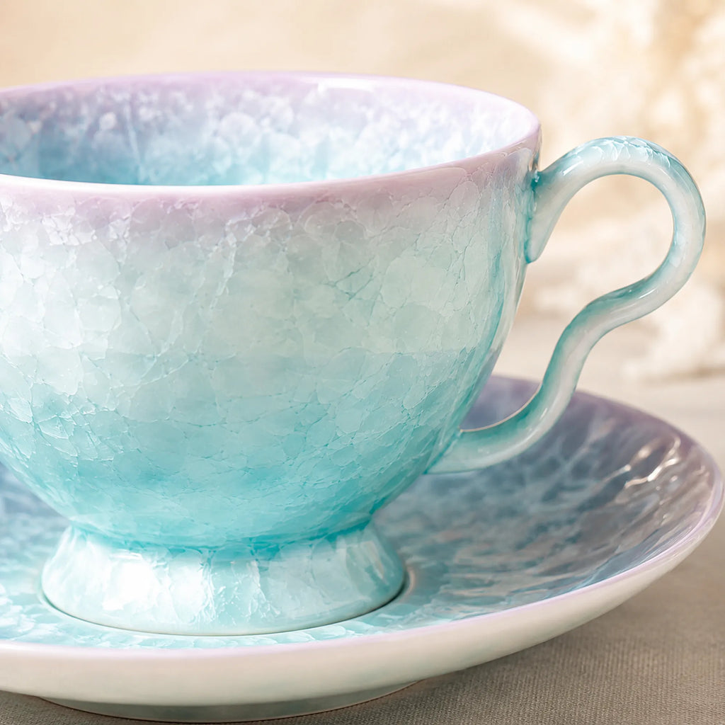 Close-up glaze detail of pearl blue ceramic coffee cup set