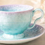 Close-up glaze detail of pearl blue ceramic coffee cup set