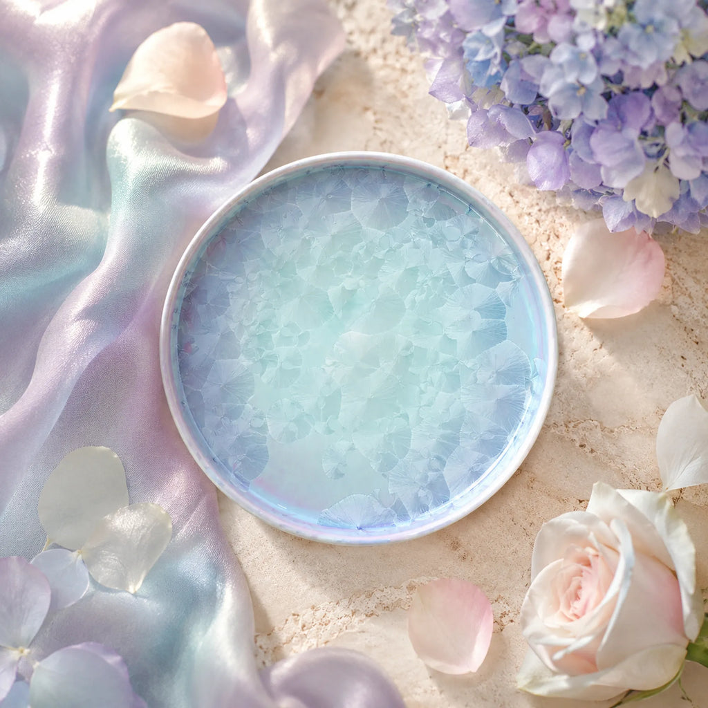 Pearl blue ceramic side plate styled on a bright dining table