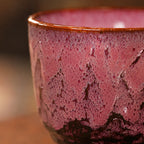 Close-up crackle glaze detail of rose pink ceramic tea cup