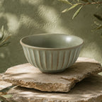 Organic sage green ceramic rice bowl with textured glaze