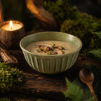 Sage green ceramic rice bowl styled with fresh food