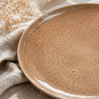 Close-up ceramic texture of sand beige dinner plate