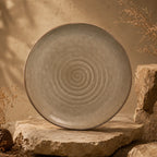 Sand brown spiral ceramic dinner plate with earthy textured finish