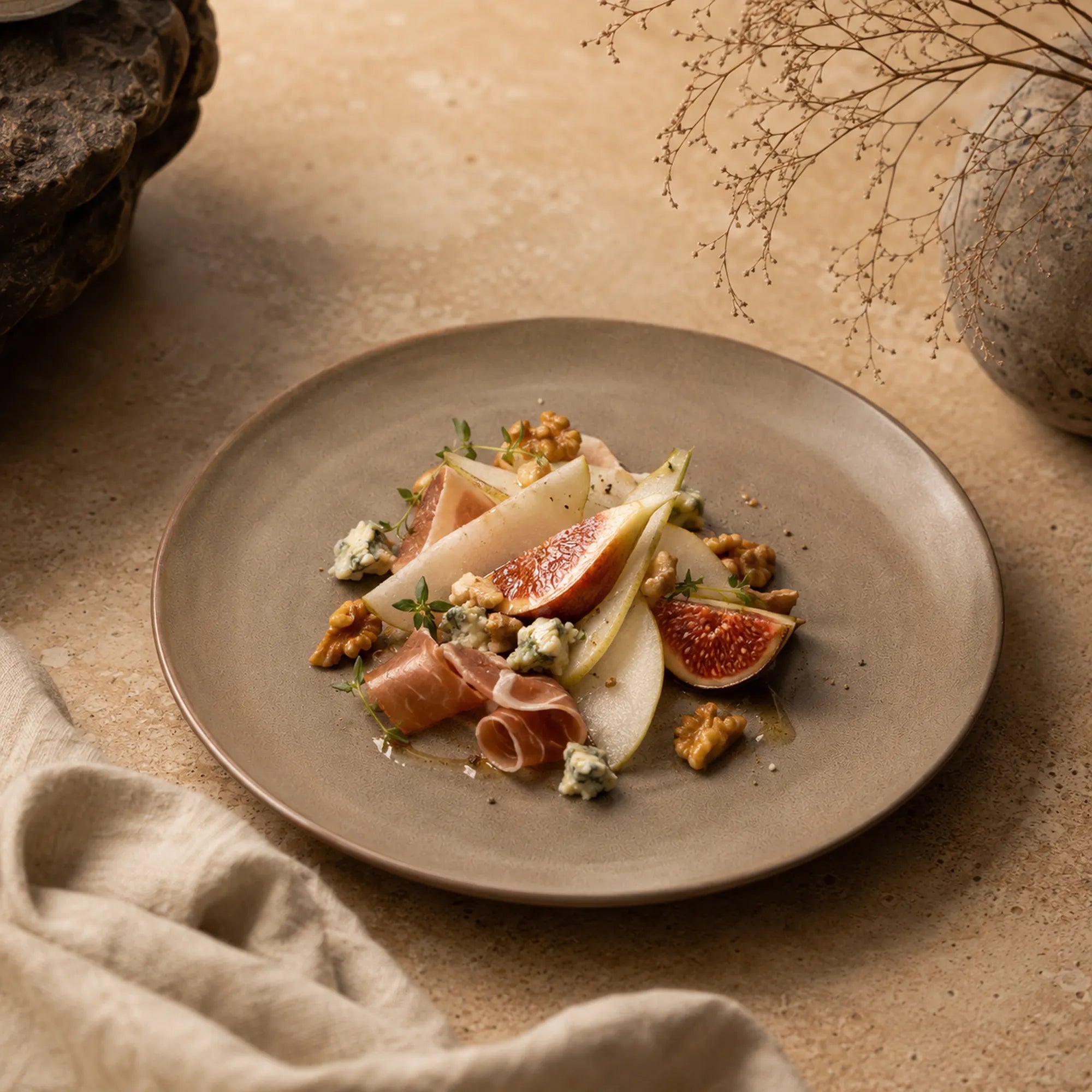 Sand brown ceramic dinner plate styled with warm food