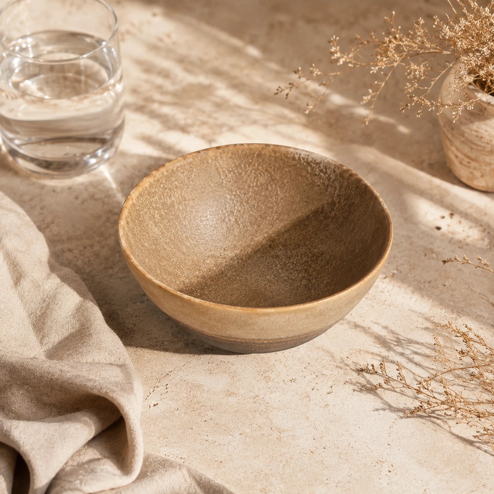 Sand brown ceramic rice bowl styled in a calm dining setting
