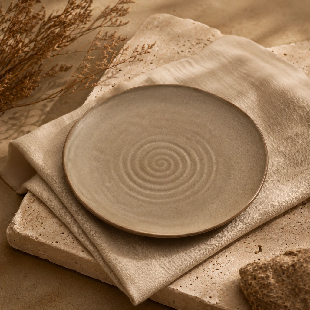 Sand brown ceramic dinnerware styled on a natural dining table