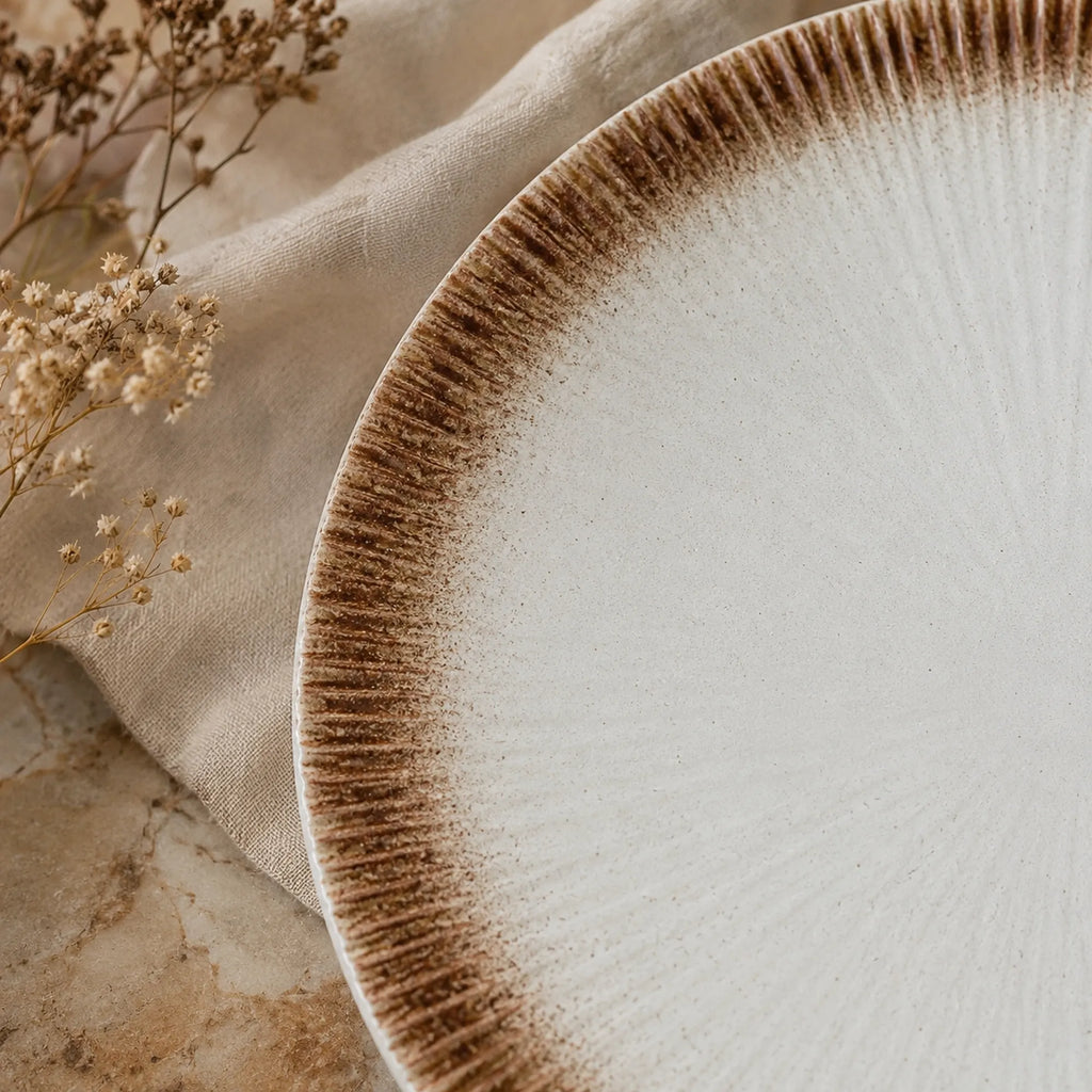 Close-up glaze detail of sand white ceramic dinner plate