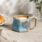 Soft sky blue ceramic coffee mug served with coffee
