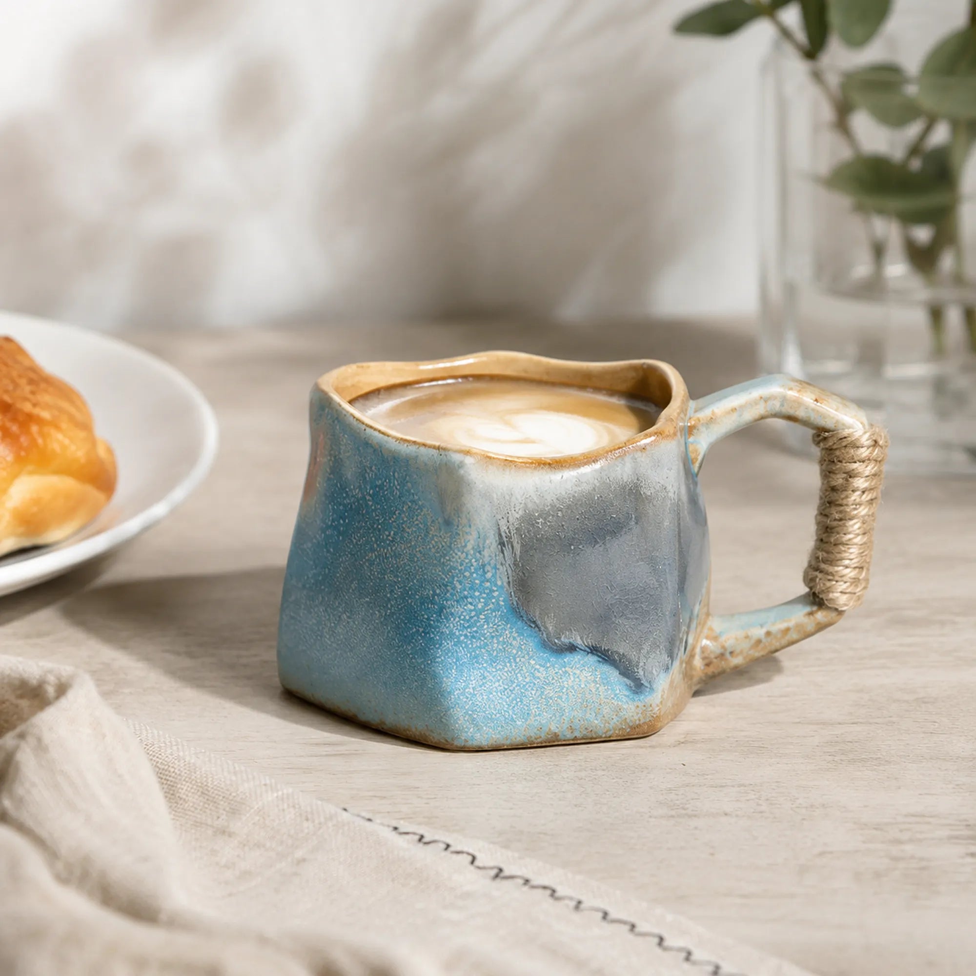 Soft sky blue ceramic coffee mug served with coffee