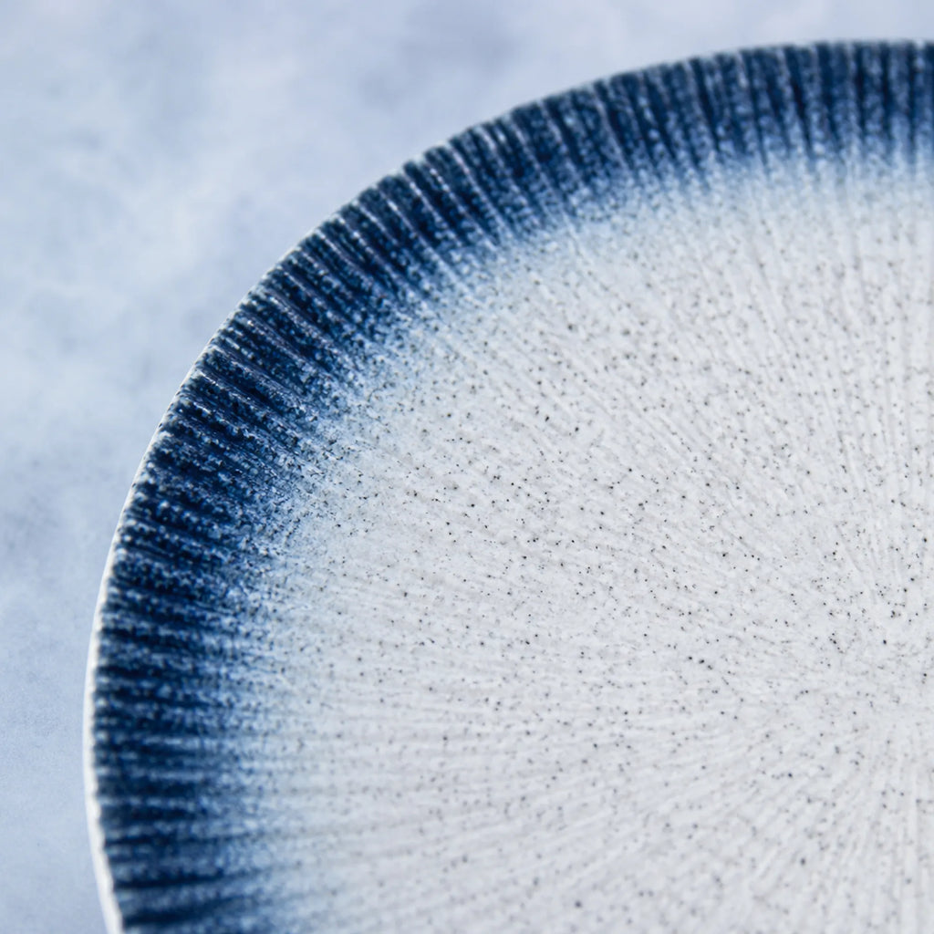 Close-up ceramic texture of midnight sky blue dinner plate