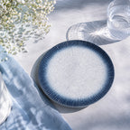Sky blue ceramic dinnerware styled in a calm dining setting
