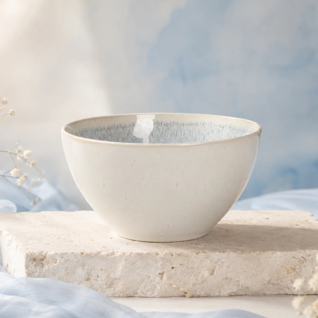 Snow white ceramic rice bowl styled on a minimalist dining table
