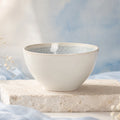 Snow white ceramic rice bowl styled on a minimalist dining table