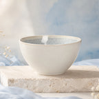 Snow white ceramic rice bowl styled on a minimalist dining table